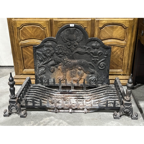 356 - An inglenook cast iron fire grate, andirons and fire back. The grate 35