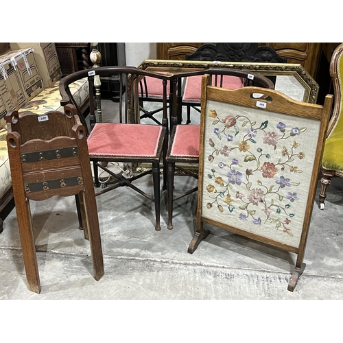 359 - A pair of Edwardian corner chairs; an needlework fire screen; an oak jardiniere stand; an onyx lamp ... 