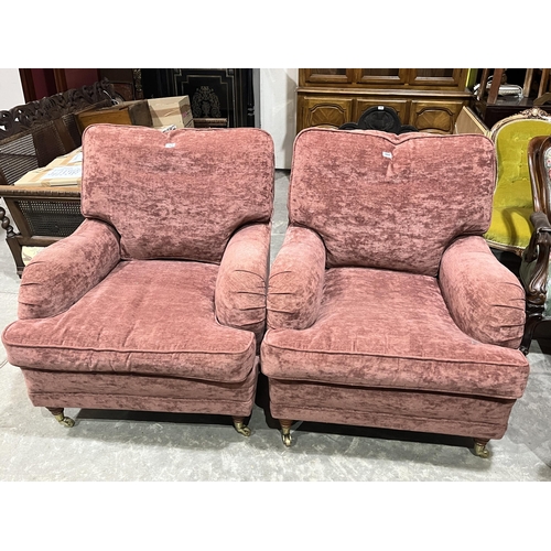 360 - A pair of upholstered armchairs.