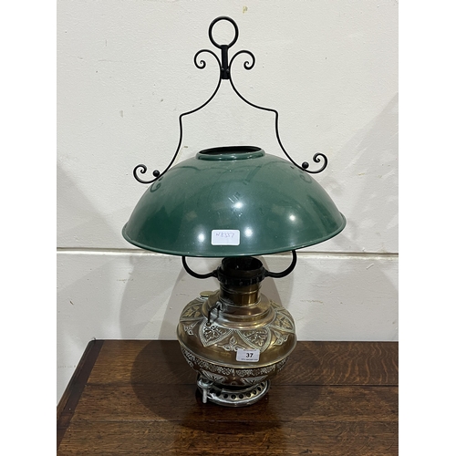 37 - A brass hanging lamp with enamel shade.