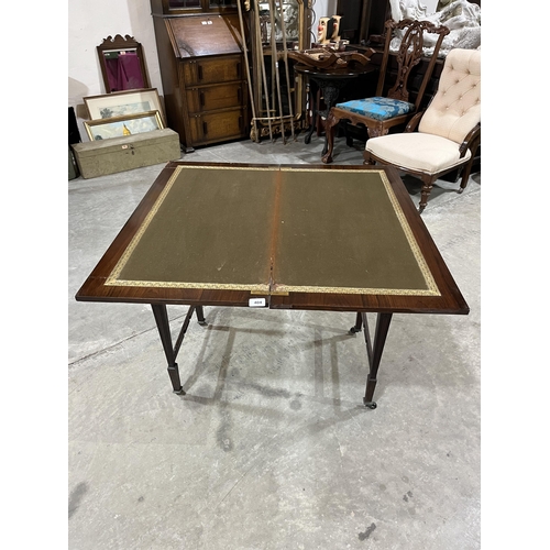 404 - An Edward VII rosewood card table on square tapered legs. 36