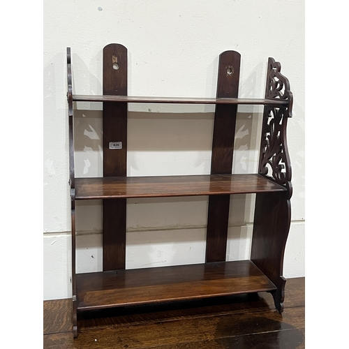 436 - A set of 19th century mahogany wall shelves with fret carved sides. 24½