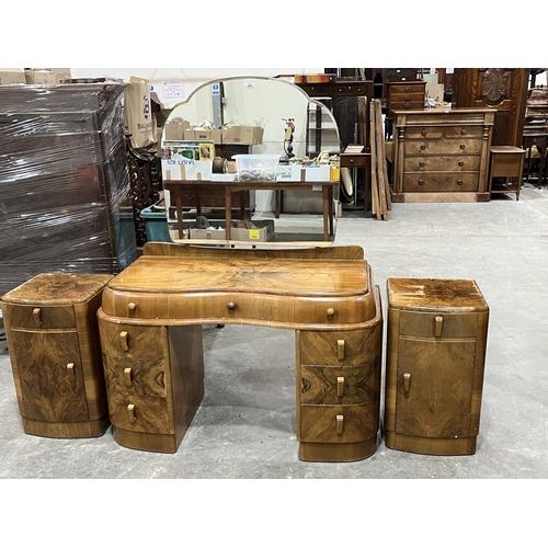 460 - A walnut dressing table with a pair of bedside cabinets.