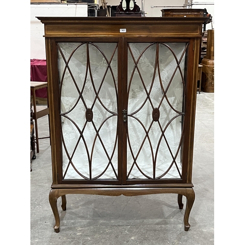 461 - An Edward VII mahogany and line inlaid display cabinet enclosed by a pair of astragal glazed doors. ... 