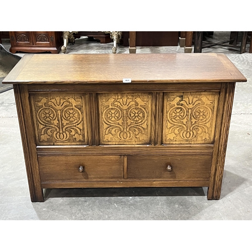 464 - An oak blanket chest and linen contents 45