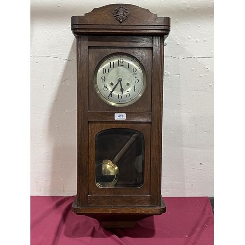 470 - A 1930s oak cased wall clock. 32