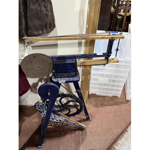 7 - A cast iron 'Hobbies' treadle saw.