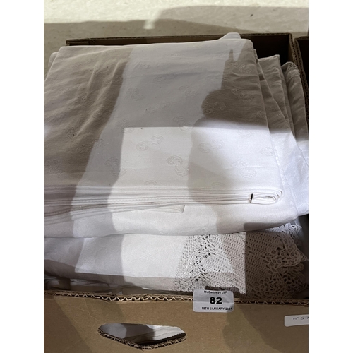 82 - Four boxes of fabric and linen