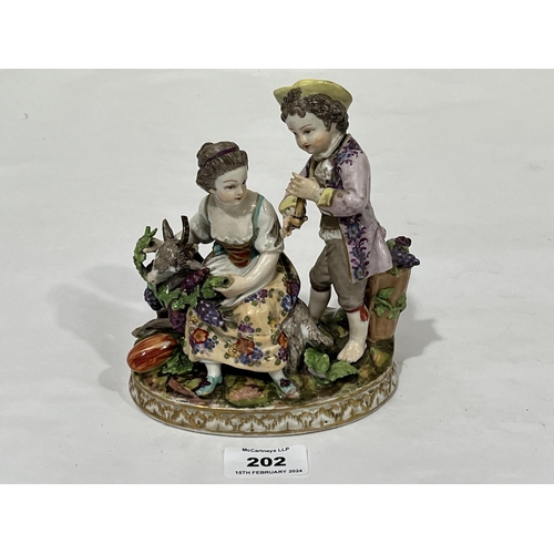 202 - A 19th Century Dresden porcelain group allegorical of autumn, of a boy and girl in bright attire, th... 