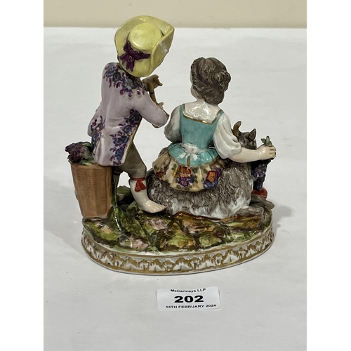 202 - A 19th Century Dresden porcelain group allegorical of autumn, of a boy and girl in bright attire, th... 