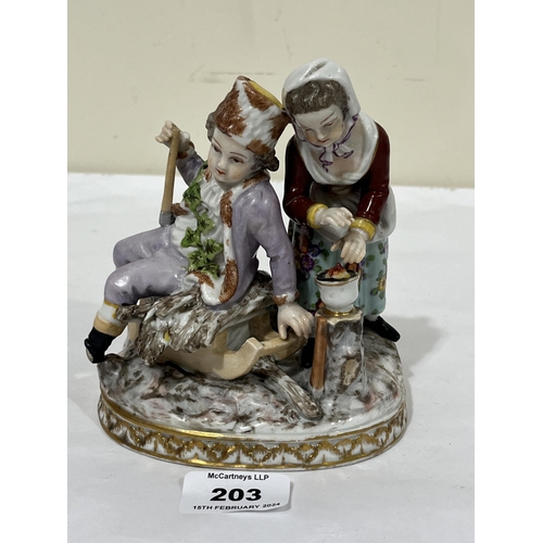 203 - A 19th Century Dresden porcelain group allegorical of winter, the boy sitting on a sledge with a bun... 