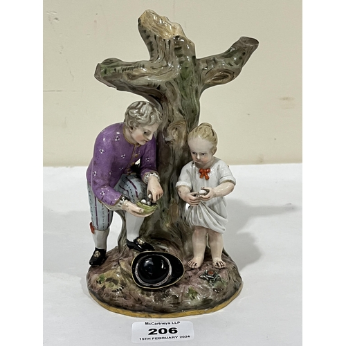 206 - A 19th Century Meissen group of a gentleman and child gathering bird's eggs. 7½