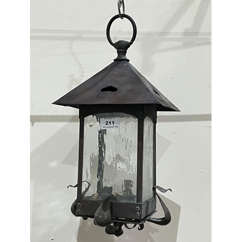 211 - A 19th Century Arts and Crafts brass hall lantern. 17