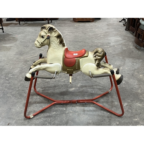 256 - A Mobo Prairie King tinplate horse toy on spring frame. c. 1955.