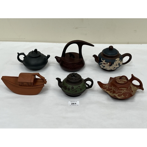 261 - Six Chinese ceramic teapots.