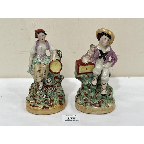 279 - A pair of 19th Century Staffordshire figures, seated boy with monkey and female companion. 7¼