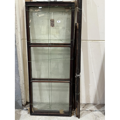 447 - Three Victorian mahogany glazed shop display cupboard doors with rails.