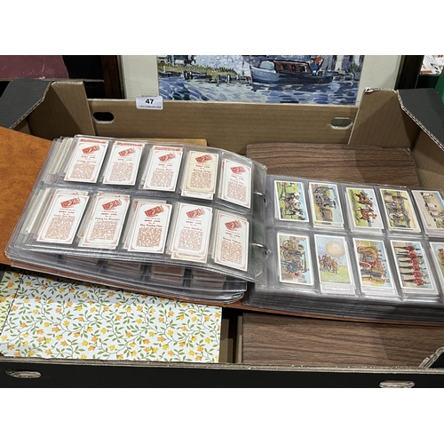 47 - Four albums of cigarette cards.