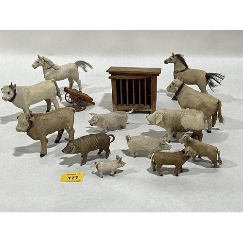 177 - A collection of animal skin toy farm animals with a wooden hutch and cart. The pig 4¼