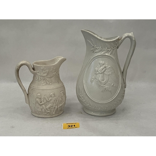 321 - Two Victorian relief decorated parian jugs, the larger 8