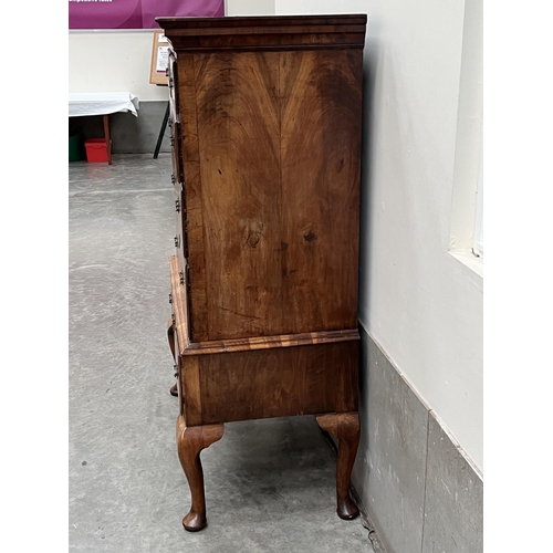 397 - A George II walnut chest on stand with two short over three long herringbone banded graduated drawer... 