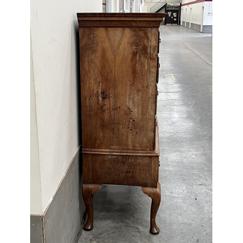 397 - A George II walnut chest on stand with two short over three long herringbone banded graduated drawer... 