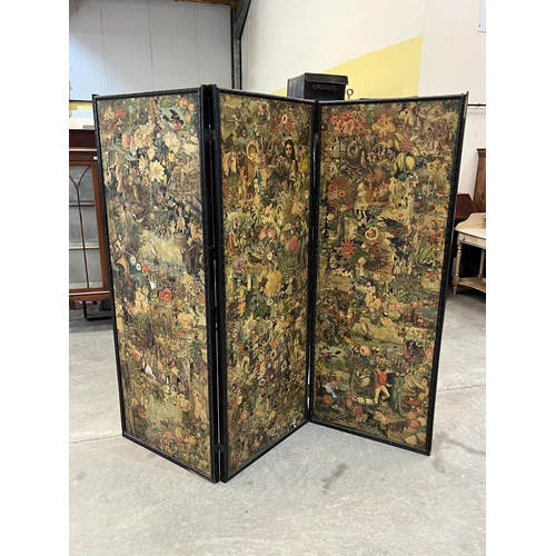 450 - A Victorian ebonised three-fold scrapwork dressing screen. 69