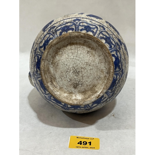 491 - A Turkish Ottoman blue and white decorated ewer, 9¾