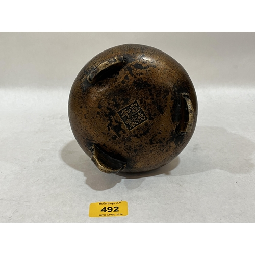 492 - A Chinese bronze censer. Four figure character mark to base. 5½