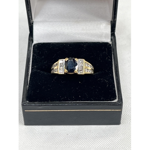 539 - An 18ct sapphire and diamond ring. 6.6g gross. Size L.