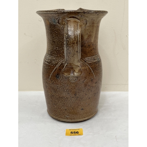 556 - * MICHAEL CASSON, OBE. BRITISH 1925-2003. A stoneware jug. Artist's seal. 10¼