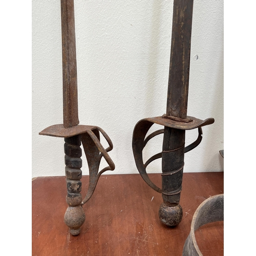 578 - Two swept hilt swords, one with leather scabbard. 36