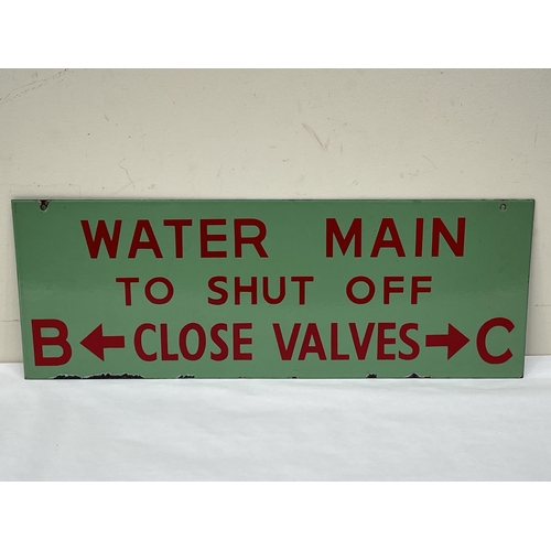 120 - A double sided hanging enamel factory sign. 9½