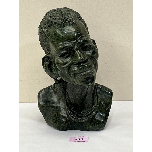 121 - A Nigerian carved hardstone bust of a man. Signed SHADU. 10