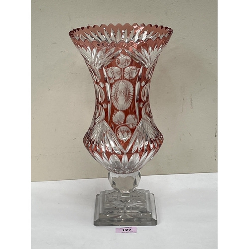 127 - A ruby overlaid cut glass flower vase. 13¾