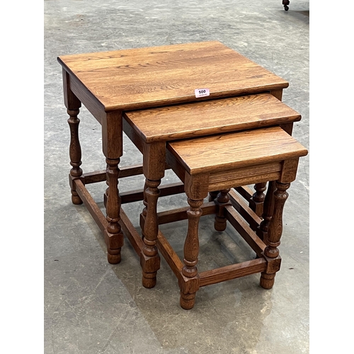 500 - A nest of three oak occasional tables.