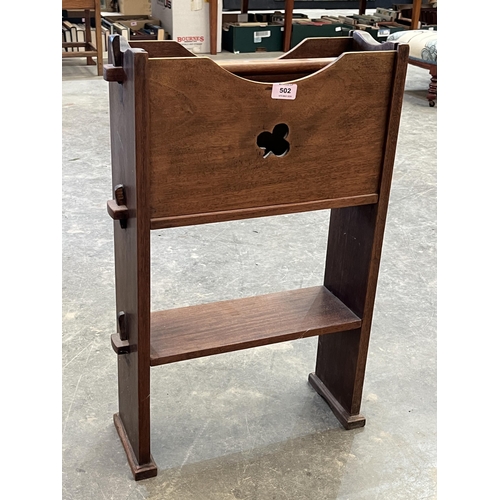 502 - An Arts and Crafts mahogany magazine and book rack. 27