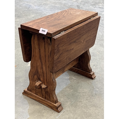 509 - An elm drop leaf occasional table. 15½