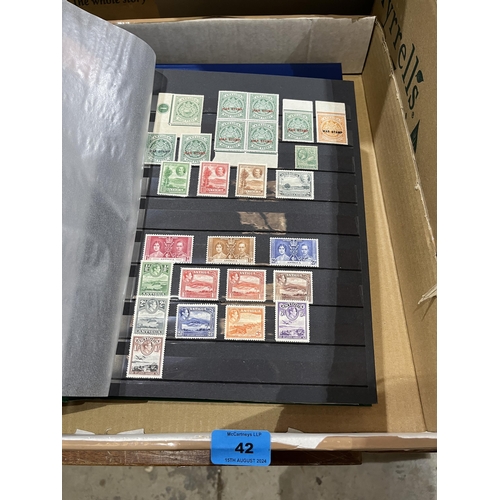 42 - An album of mint Commonwealth and Empire stamps and an album of British stamps.