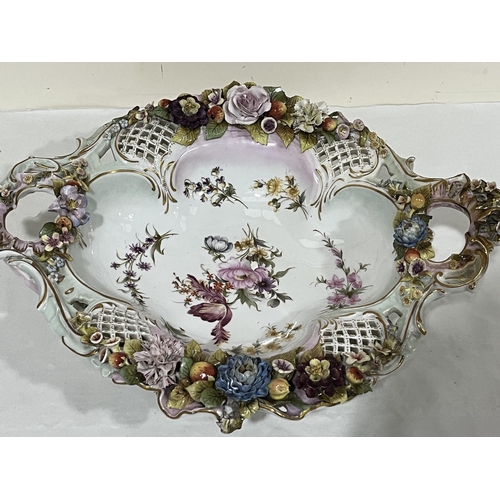 173 - A late 19th Century German centrepiece bowl, applied with encrustations of flowers, gilded and paint... 