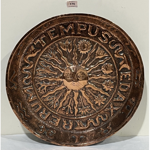 176 - A 19th Century Arts and Crafts copper bowl, repousse decorated with the radiating sun to the centre ... 