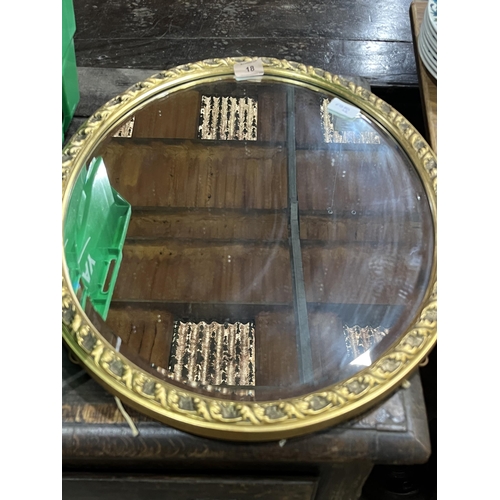 18 - A box of copper and brassware with a gilt framed mirror.