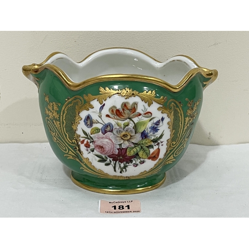 181 - A small Sevres jardiniere, gilded on a green ground and painted with summer flowers in two reserves.... 