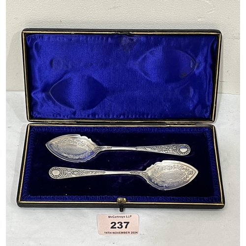 237 - A Victorian cased pair of silver spoons with bright cut bowls. Sheffield 1897. 1oz 16dwts.