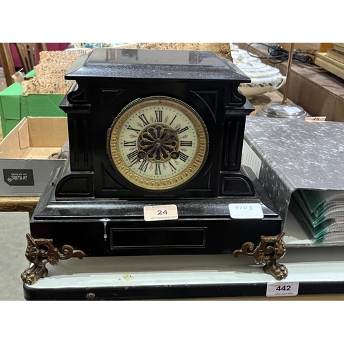 24 - A French slate cased mantle clock with brass drum movement. 12