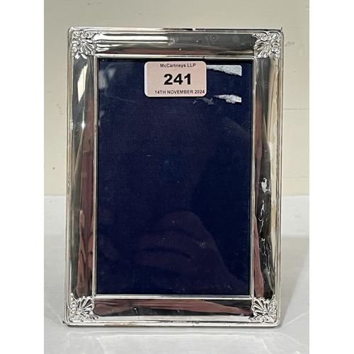 241 - An Elizabeth II silver fronted photograph frame. Sheffield 2000. 7¼