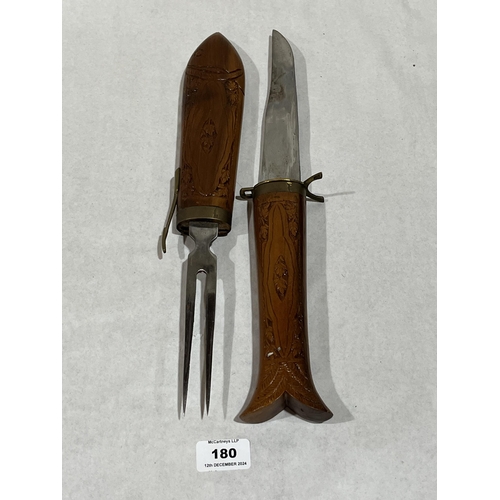 180 - An Indian carving set in carved fish case, 17