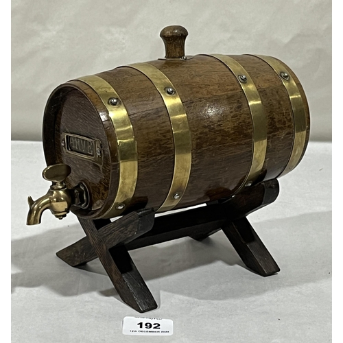 192 - A brass bound barrel on cruciform stand. 8