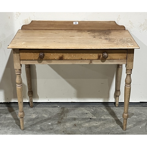 423 - A Victorian pine washstand with frieze drawer on turned legs. 35