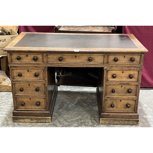 427 - A Victorian oak pedestal desk with inlet top. 46